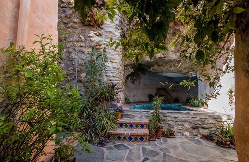Guajar Faraguit House | Romatic Andalusian village house, solar-heated Jacuzzi cave pool