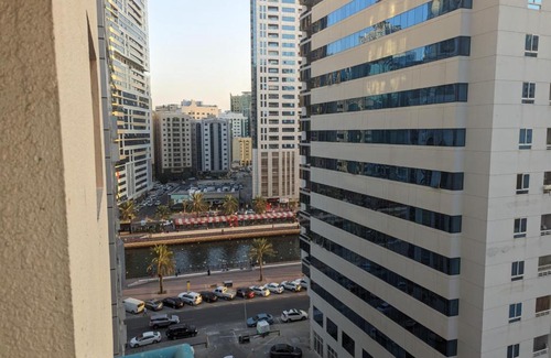 Al Majaz House | Room for Rent in a Family Apartment- Waterfront View