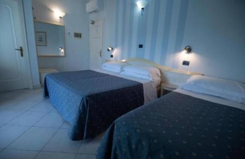 Viareggio House | Room in Guest Room - Fly in Viareggio Beach in Front of the Famous Promenade With Shops and Establishments
