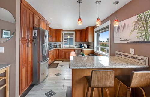 South Delridge House | Roomy, dog-friendly home with private hot tub, fireplaces, decks & living spaces