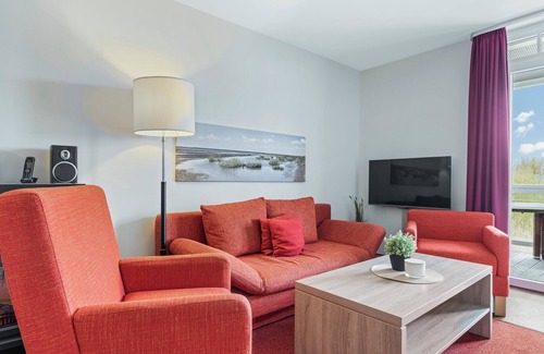 Wremen Apartment | Ruhige, Schöne Wohnung in Strandnähe mit Sauna und Balkon mit Blick ins Grüne