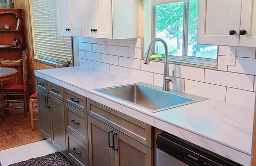 Bass Lake House | Rustic Lakeview Lodge at Bass Lake. Bookable boat slip!