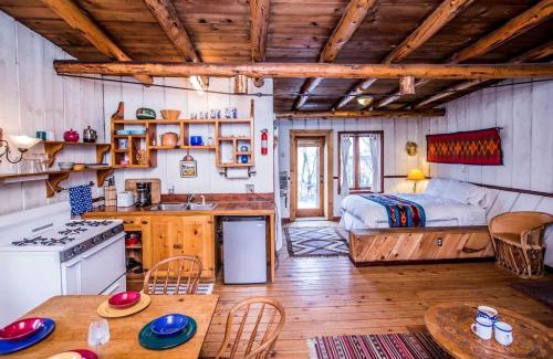 San Cristobal House | Rustic Log Cabin on Eco-Friendly Farm near Taos, New Mexico