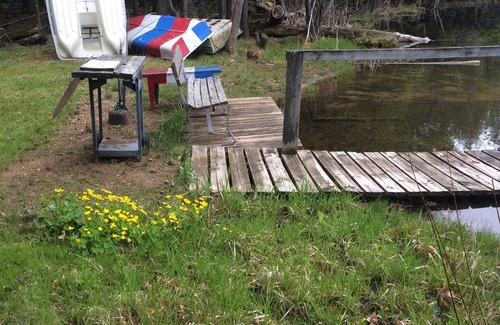 Mesick Cabin | Rustic Treehouse on fabulous private boating, fishing and swimming lake