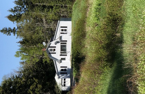 West Tremont House | Rustic vintage cottage in Duck Cove with limited ocean view.
