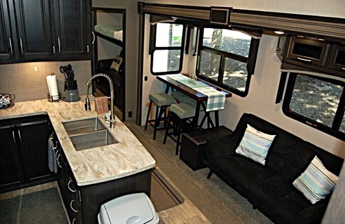 Broken Bow House | RV among the trees in Broken Bow. Dog friendly, WiFi, 2 bedroom, fireplace.