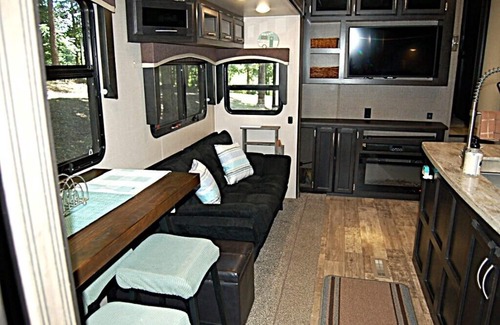 Broken Bow House | RV among the trees in Broken Bow. Dog friendly, WiFi, 2 bedroom, fireplace.