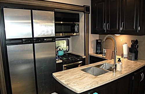 Broken Bow House | RV among the trees in Broken Bow. Dog friendly, WiFi, 2 bedroom, fireplace.