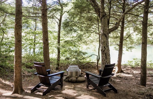 Grafton County RV Rental | Safari Tent Site 5 | 1 King Bed | Pond View