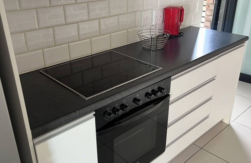 Windhoek Apartment | Safe and secure Wild olive apartments. 2 minutes walk to the mall and Hospital
