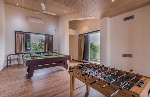 Wadgaon Villa | SaffronStays Le Reve - party villa with pool, gazebo, games room and steam room