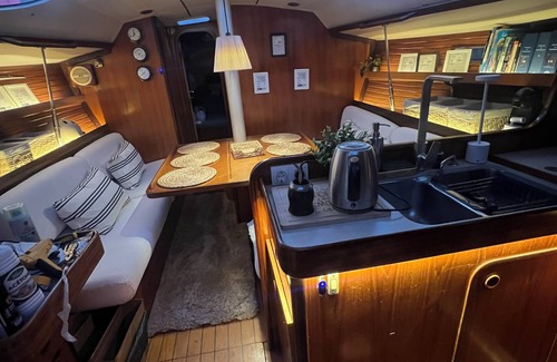 Mahon Boat Rental | Sailboat moored in the exclusive port of Mahon, ideal for couples and friends.