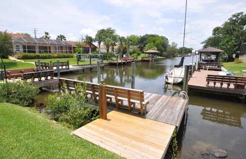 Palm Harbor House | Salt Life Cozy Canal Front Pool Home W boat dock