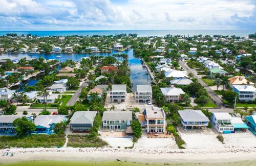 Anna Maria House | Salty Pirate - NEW Luxury Canal Front Home wWater View PoolSpa Bikes Kayaks Toys