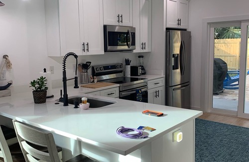 St. Augustine Beach House | Sand pail Beach Cottage 3+/2.5 house- steps to the beach-private pool- 5 stars
