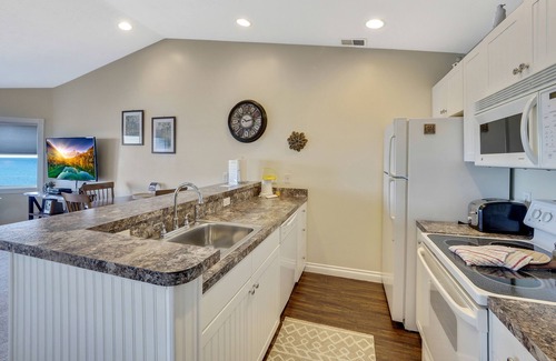 Traverse City Condo | Sandy Beachfront | Condo #328 | Pool | Hot Tub | Balcony Lake Views