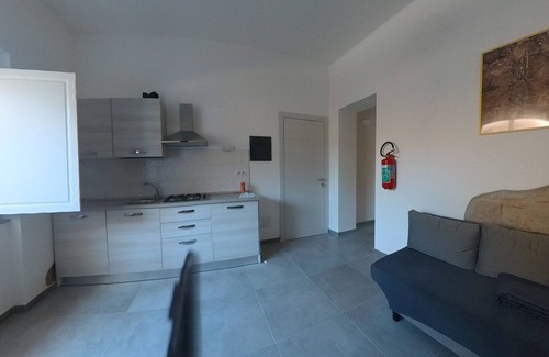 Sant'Antioco House | Sant Antioco Yellow Apartment with 2 Way Air Con