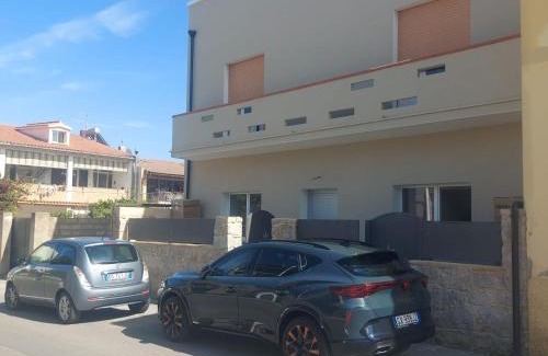 Sant'Antioco House | Sant Antioco Yellow Apartment with 2 Way Air Con