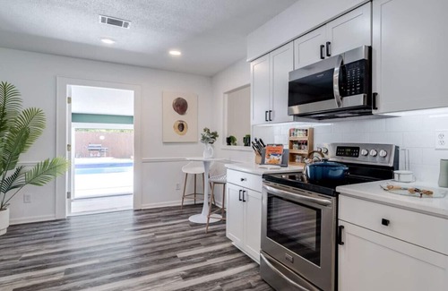 Savannah House | Savannah & Tybee Island Peach House! Pool + Hot Tub Game Room & Cabana