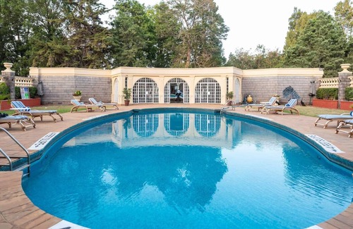 Limuru House | Scenic Escape: Elegant Room Overlooking Lush Grounds
