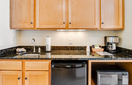 Three Lakes Condo | Scenic lakefront condo with pool, hot tub, gym & central AC