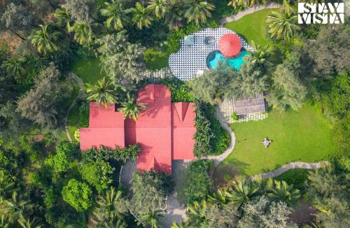 Nagaon Villa | Sea Breeze by StayVista - Beachside bliss with a splash of creativity with Pool, gazebo, lush lawn, and an artistically inspired house