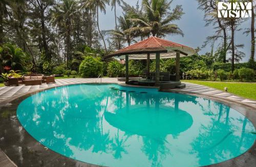 Nagaon Villa | Sea Breeze by StayVista - Beachside bliss with a splash of creativity with Pool, gazebo, lush lawn, and an artistically inspired house