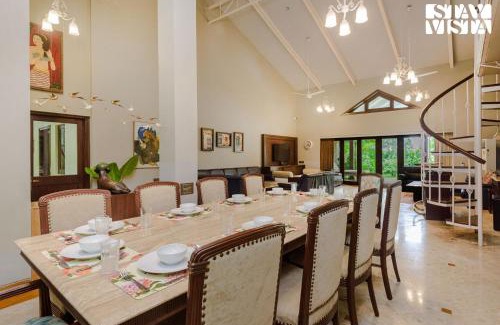 Nagaon Villa | Sea Breeze by StayVista - Beachside bliss with a splash of creativity with Pool, gazebo, lush lawn, and an artistically inspired house