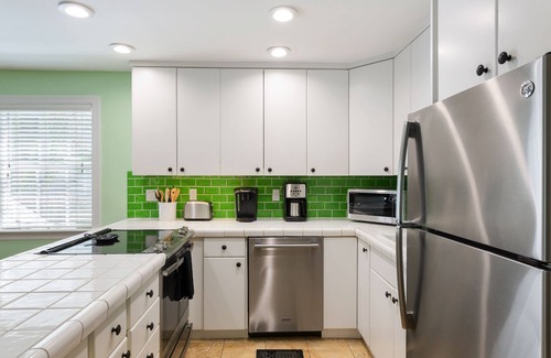 Key West Historic District Apartment | SEA CONCH~ Amazing location with shared pool, deck, and parking!