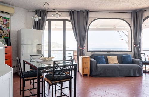 Spisone Apartment | Sea view apartment of about 90 sqm, able to accommodate up to 4 people, located on the ground floor of a building.The property is located in Taormina, in a unique panoramic position, suspended above a rock and with the beach right in front of the apartme
