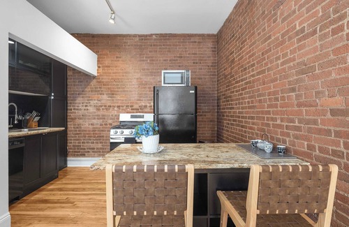 Financial District Apartment | Seaport Place by StayHaus | Floor-through 1BR Loft