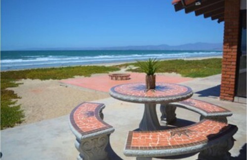 Lengueta Arenosa House | Searenity Keep an eye on kids. You: on patio with a refreshing beverage.