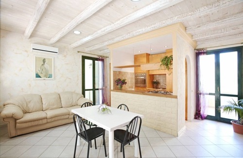 Chia Villa | Seaside villa with garden and panoramic mountain views.