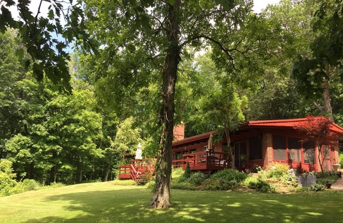 Glouster House | Secluded 5 BR brick ranch with a panoramic view of the lake through the trees