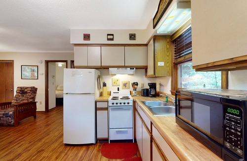 Whittier Cottage | Secluded riverside cabin great for fishing with two large decks