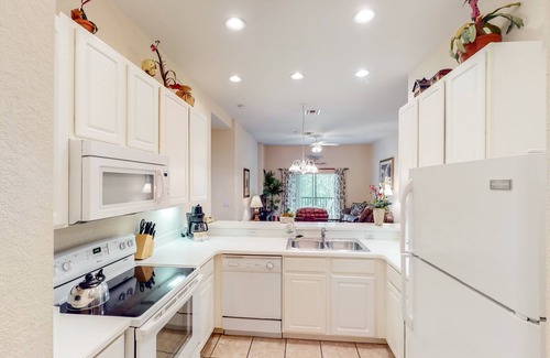 Bahama Bay Condo | Second-floor condo with basketball court, tennis court, sauna, restaurant, pools