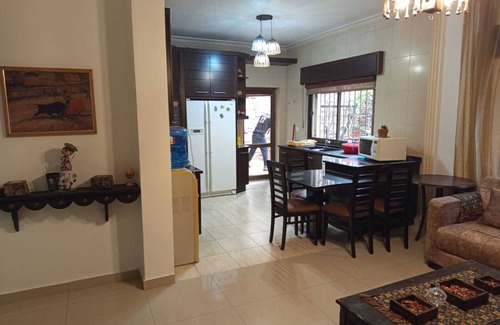 Amman Apartment | Serene 3-bedroom apartment with AC and garden in charming Amman