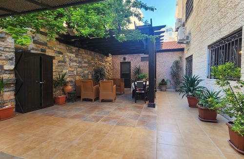 Amman Apartment | Serene 3-bedroom apartment with AC and garden in charming Amman