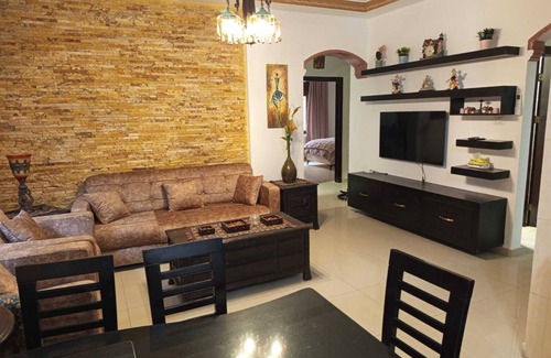 Amman Apartment | Serene 3-bedroom apartment with AC and garden in charming Amman