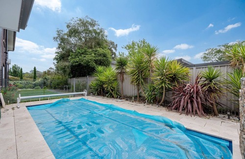 Curtin House | Serene 3-Bedroom Oasis with Pool & Lush Garden
