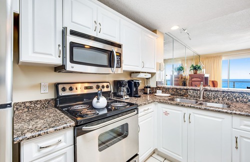 Destin Condo | Serene beachfront home with furnished balcony, pool & fitness room access