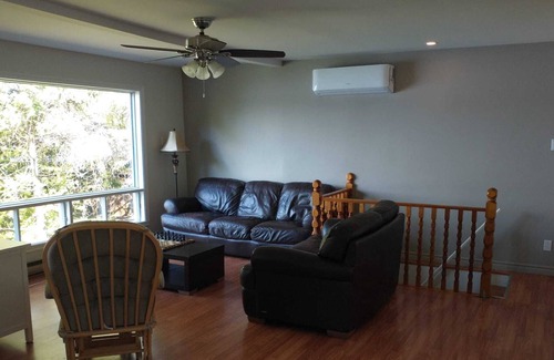 Notre-Dame-de-Pontmain Cottage | Serene waterfront 4 bdrm/2 bath cottage with wifi/hot tub/deck/bbq/firepit/dock