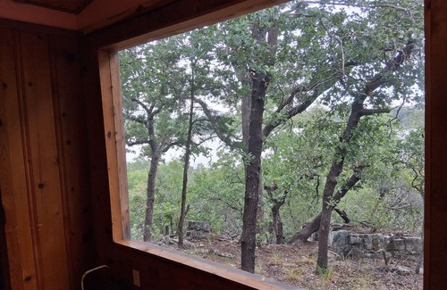Gordon Cottage | Serene lake front cabin set on bluff overlooking Palo Pinto lake.