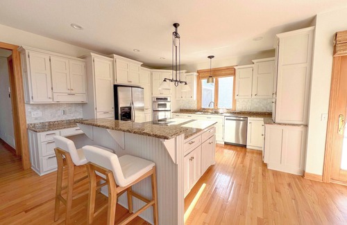 Hugo House | Serene Suburban Retreat with Hot Tub next to the Super Rink, 3M Open and USA Cup