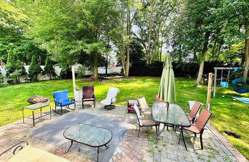 Coram Apartment | Serenity Haven: Cozy 2-Bedroom Home with Spacious Living & Big Backyard