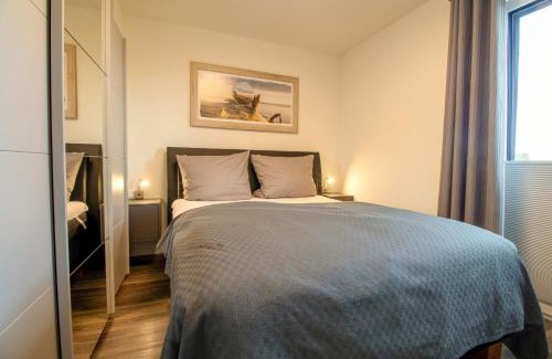 Fedderwardersiel Apartment | Sielhuus 11 Ferienwohnung mit Dachterrasse und Infrarotsauna und Kamin für bis zu 4 Personen in Fedderwardersiel!