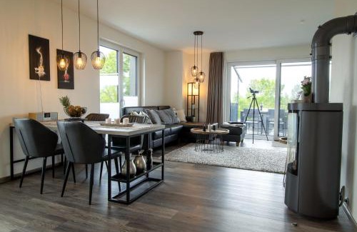 Fedderwardersiel Apartment | Sielhuus 11 Ferienwohnung mit Dachterrasse und Infrarotsauna und Kamin für bis zu 4 Personen in Fedderwardersiel!
