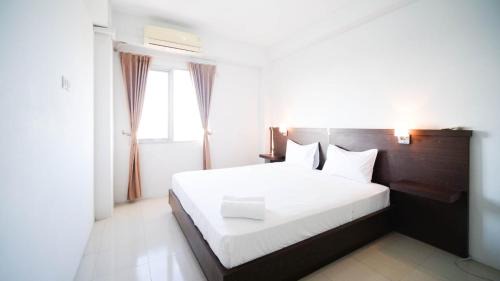 Surabaya Apartment | Simple 2BR with Extra Bed at Menara Rungkut Apartment By Travelio