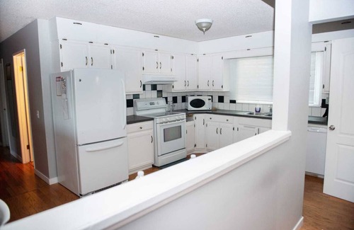 Calgary House | Simply beautiful and comfortable main suite with a view.