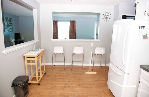 Calgary House | Simply beautiful and comfortable main suite with a view.